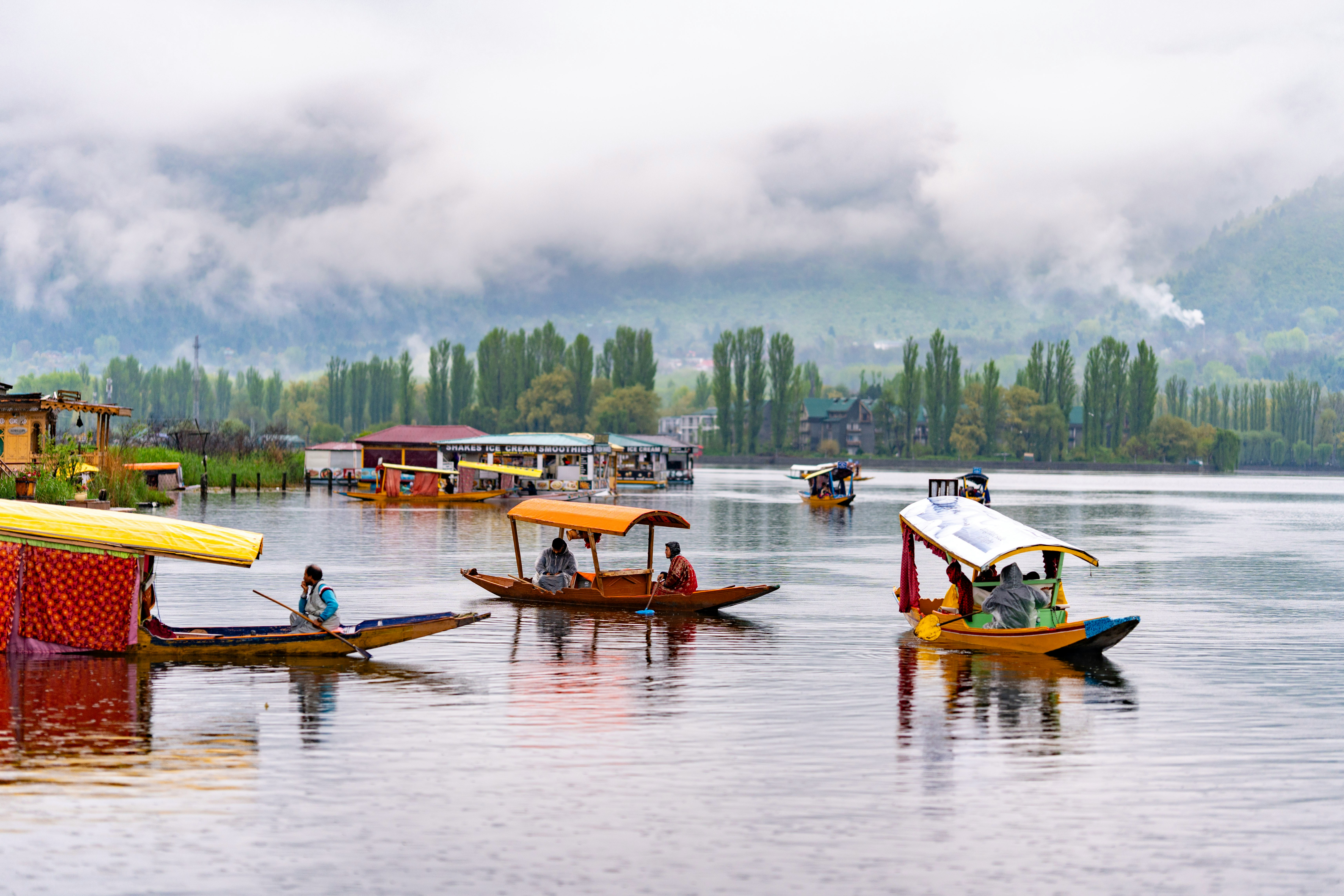 Serene morning view of Dal Lake Srinagar Kashmir with wooden houseboats